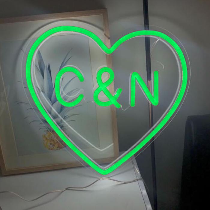 Green heart shaped neon sign with personalised initials
